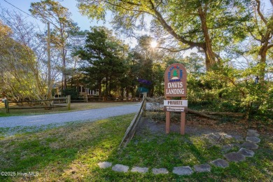 Nestled in the maritime forest of Pine Knoll Shores, this island on The Country Club of the Crystal Coast in North Carolina - for sale on GolfHomes.com, golf home, golf lot