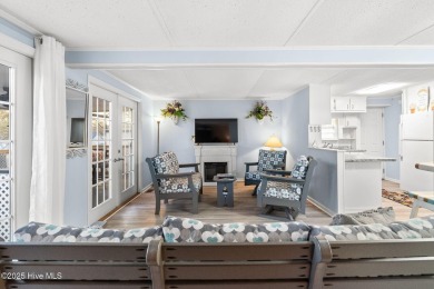 This charming residence is ideally located near the beach on Oyster Bay Golf Links in North Carolina - for sale on GolfHomes.com, golf home, golf lot