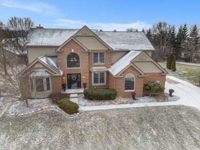 Peace and privacy are yours at this impressive brick home on a on Stonebridge Golf Club in Michigan - for sale on GolfHomes.com, golf home, golf lot