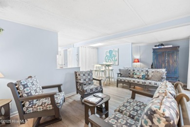 This charming residence is ideally located near the beach on Oyster Bay Golf Links in North Carolina - for sale on GolfHomes.com, golf home, golf lot