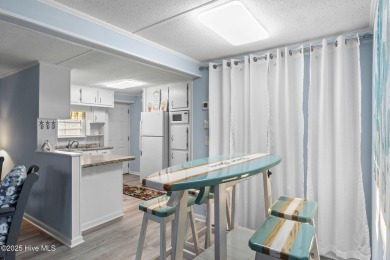 This charming residence is ideally located near the beach on Oyster Bay Golf Links in North Carolina - for sale on GolfHomes.com, golf home, golf lot