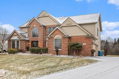 Peace and privacy are yours at this impressive brick home on a on Stonebridge Golf Club in Michigan - for sale on GolfHomes.com, golf home, golf lot