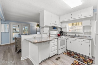 This charming residence is ideally located near the beach on Oyster Bay Golf Links in North Carolina - for sale on GolfHomes.com, golf home, golf lot