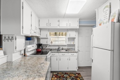 This charming residence is ideally located near the beach on Oyster Bay Golf Links in North Carolina - for sale on GolfHomes.com, golf home, golf lot