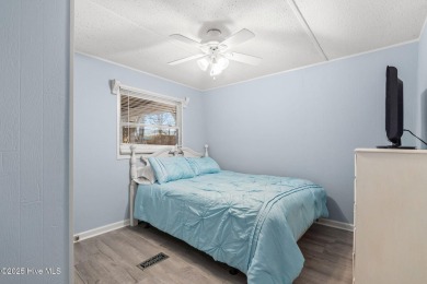 This charming residence is ideally located near the beach on Oyster Bay Golf Links in North Carolina - for sale on GolfHomes.com, golf home, golf lot