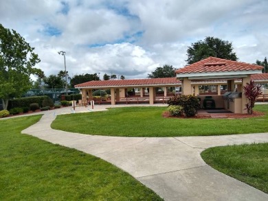 Great kitchen area with pass through counter and open walkway to on Four Lakes Golf Club in Florida - for sale on GolfHomes.com, golf home, golf lot