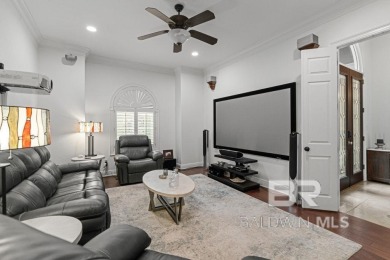 Discover coastal luxury in this former model home, meticulously on Peninsula Golf and Racquet Club in Alabama - for sale on GolfHomes.com, golf home, golf lot