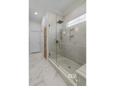 Discover coastal luxury in this former model home, meticulously on Peninsula Golf and Racquet Club in Alabama - for sale on GolfHomes.com, golf home, golf lot