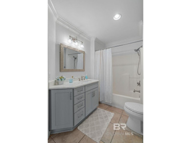 Discover coastal luxury in this former model home, meticulously on Peninsula Golf and Racquet Club in Alabama - for sale on GolfHomes.com, golf home, golf lot