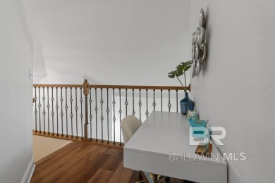 Discover coastal luxury in this former model home, meticulously on Peninsula Golf and Racquet Club in Alabama - for sale on GolfHomes.com, golf home, golf lot