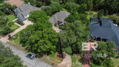 Discover coastal luxury in this former model home, meticulously on Peninsula Golf and Racquet Club in Alabama - for sale on GolfHomes.com, golf home, golf lot
