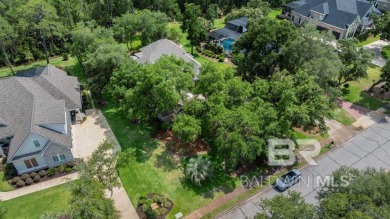 Discover coastal luxury in this former model home, meticulously on Peninsula Golf and Racquet Club in Alabama - for sale on GolfHomes.com, golf home, golf lot