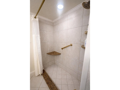 This exceptional two-bedroom, two-bath residence offers refined on The Little Club in Florida - for sale on GolfHomes.com, golf home, golf lot