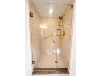 This exceptional two-bedroom, two-bath residence offers refined on The Little Club in Florida - for sale on GolfHomes.com, golf home, golf lot