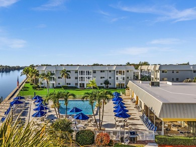 This exceptional two-bedroom, two-bath residence offers refined on The Little Club in Florida - for sale on GolfHomes.com, golf home, golf lot