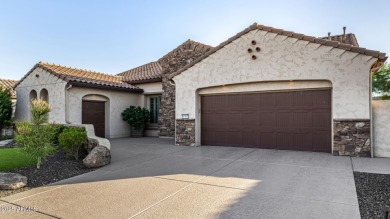 Classy Treviso home presenting curb appeal that makes you want on Tuscany Falls At Pebble Creek in Arizona - for sale on GolfHomes.com, golf home, golf lot