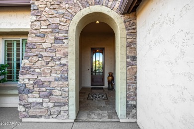Classy Treviso home presenting curb appeal that makes you want on Tuscany Falls At Pebble Creek in Arizona - for sale on GolfHomes.com, golf home, golf lot