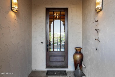 Classy Treviso home presenting curb appeal that makes you want on Tuscany Falls At Pebble Creek in Arizona - for sale on GolfHomes.com, golf home, golf lot