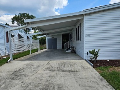 This home is on leased land, meaning buyers do not own the land on Big Cypress Golf and Country Club in Florida - for sale on GolfHomes.com, golf home, golf lot