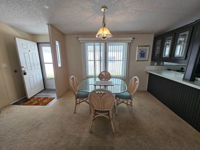 This home is on leased land, meaning buyers do not own the land on Big Cypress Golf and Country Club in Florida - for sale on GolfHomes.com, golf home, golf lot