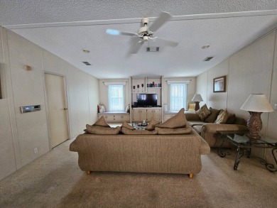 This home is on leased land, meaning buyers do not own the land on Big Cypress Golf and Country Club in Florida - for sale on GolfHomes.com, golf home, golf lot