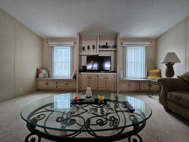 This home is on leased land, meaning buyers do not own the land on Big Cypress Golf and Country Club in Florida - for sale on GolfHomes.com, golf home, golf lot