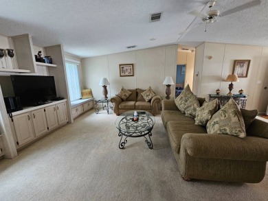 This home is on leased land, meaning buyers do not own the land on Big Cypress Golf and Country Club in Florida - for sale on GolfHomes.com, golf home, golf lot