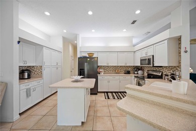 Step into this exceptional 4-bedroom, 2.5-bath pool home on The Venice Golf and Country Club in Florida - for sale on GolfHomes.com, golf home, golf lot