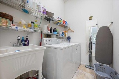 Step into this exceptional 4-bedroom, 2.5-bath pool home on The Venice Golf and Country Club in Florida - for sale on GolfHomes.com, golf home, golf lot