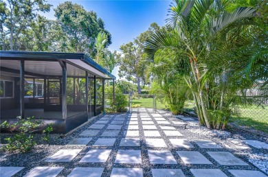Charming Mid-Century Home on a Spacious Corner Lot in Pasadena on Pasadena Yacht and Country Club in Florida - for sale on GolfHomes.com, golf home, golf lot