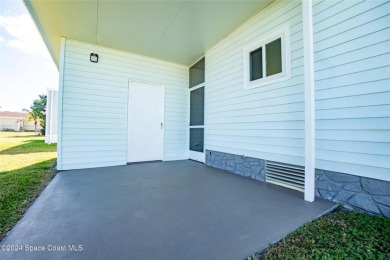 Welcome to your dream home in serene Barefoot Bay, FL! This on Barefoot Bay Golf Course in Florida - for sale on GolfHomes.com, golf home, golf lot