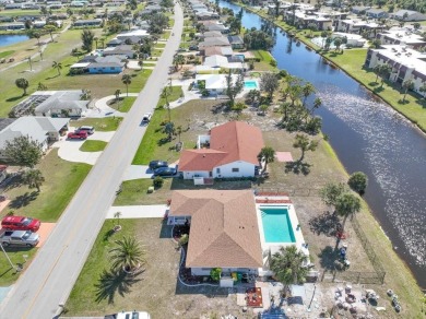 This fully furnished, three-bedroom, three-bathroom waterfront on Rotonda Golf and Country Club The Hills Course in Florida - for sale on GolfHomes.com, golf home, golf lot