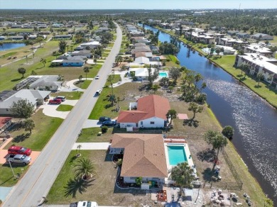 This fully furnished, three-bedroom, three-bathroom waterfront on Rotonda Golf and Country Club The Hills Course in Florida - for sale on GolfHomes.com, golf home, golf lot