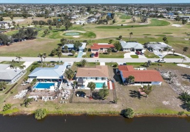 This fully furnished, three-bedroom, three-bathroom waterfront on Rotonda Golf and Country Club The Hills Course in Florida - for sale on GolfHomes.com, golf home, golf lot