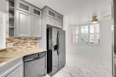Beautifully updated 3 bedroom, 2 bath first-floor corner condo on Sunrise Lakes Phase IV Golf Course in Florida - for sale on GolfHomes.com, golf home, golf lot