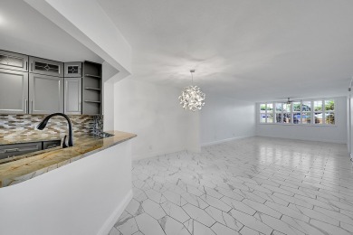 Beautifully updated 3 bedroom, 2 bath first-floor corner condo on Sunrise Lakes Phase IV Golf Course in Florida - for sale on GolfHomes.com, golf home, golf lot