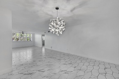 Beautifully updated 3 bedroom, 2 bath first-floor corner condo on Sunrise Lakes Phase IV Golf Course in Florida - for sale on GolfHomes.com, golf home, golf lot