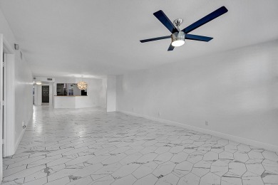 Beautifully updated 3 bedroom, 2 bath first-floor corner condo on Sunrise Lakes Phase IV Golf Course in Florida - for sale on GolfHomes.com, golf home, golf lot