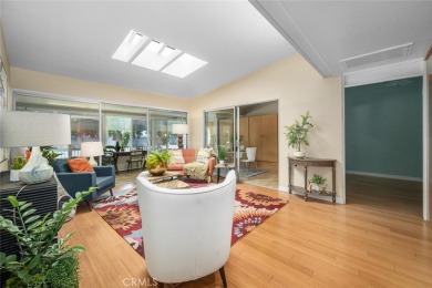 Nestled behind mature trees, this charming home offers a serene on Leisure World Seal Beach Golf Course in California - for sale on GolfHomes.com, golf home, golf lot