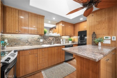 Nestled behind mature trees, this charming home offers a serene on Leisure World Seal Beach Golf Course in California - for sale on GolfHomes.com, golf home, golf lot