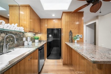 Nestled behind mature trees, this charming home offers a serene on Leisure World Seal Beach Golf Course in California - for sale on GolfHomes.com, golf home, golf lot