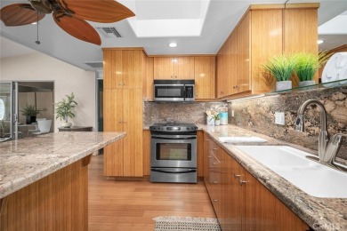 Nestled behind mature trees, this charming home offers a serene on Leisure World Seal Beach Golf Course in California - for sale on GolfHomes.com, golf home, golf lot