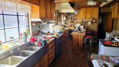 Large multi-purpose fixer-upper building in the heart of the on Twin Falls Resort State Park in West Virginia - for sale on GolfHomes.com, golf home, golf lot