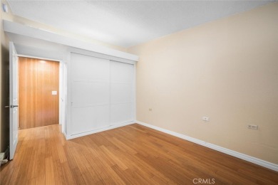 Nestled behind mature trees, this charming home offers a serene on Leisure World Seal Beach Golf Course in California - for sale on GolfHomes.com, golf home, golf lot
