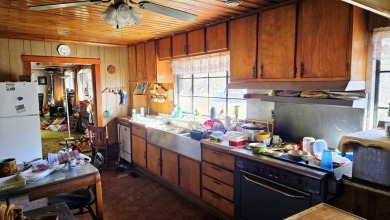 Large multi-purpose fixer-upper building in the heart of the on Twin Falls Resort State Park in West Virginia - for sale on GolfHomes.com, golf home, golf lot