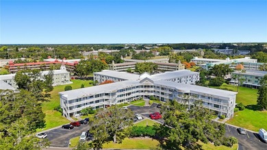 Welcome to this light and bright two-bedroom, two-bathroom condo on On Top Of The World Golf Course in Florida - for sale on GolfHomes.com, golf home, golf lot