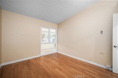 Nestled behind mature trees, this charming home offers a serene on Leisure World Seal Beach Golf Course in California - for sale on GolfHomes.com, golf home, golf lot