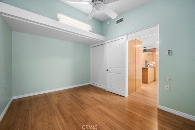 Nestled behind mature trees, this charming home offers a serene on Leisure World Seal Beach Golf Course in California - for sale on GolfHomes.com, golf home, golf lot