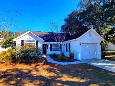 This lovely home overlooks the lake and is located in the on Wedgefield Plantation Golf Club in South Carolina - for sale on GolfHomes.com, golf home, golf lot