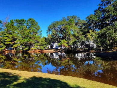 This lovely home overlooks the lake and is located in the on Wedgefield Plantation Golf Club in South Carolina - for sale on GolfHomes.com, golf home, golf lot